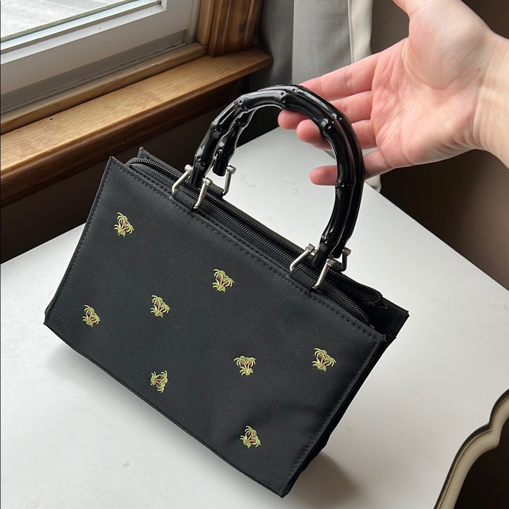 Black Designer Handbag with Embroidered Accents